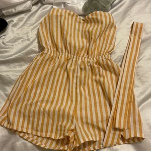Mustard yellow and white striped romper.
